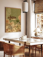 Spotted pufferfish swimming right in green water with white and brown coral, plants, and shells on, in a styled room mockup