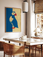 Graphic puffin wall art illustration in blue, yellow, and red on textured paper. - Image 3