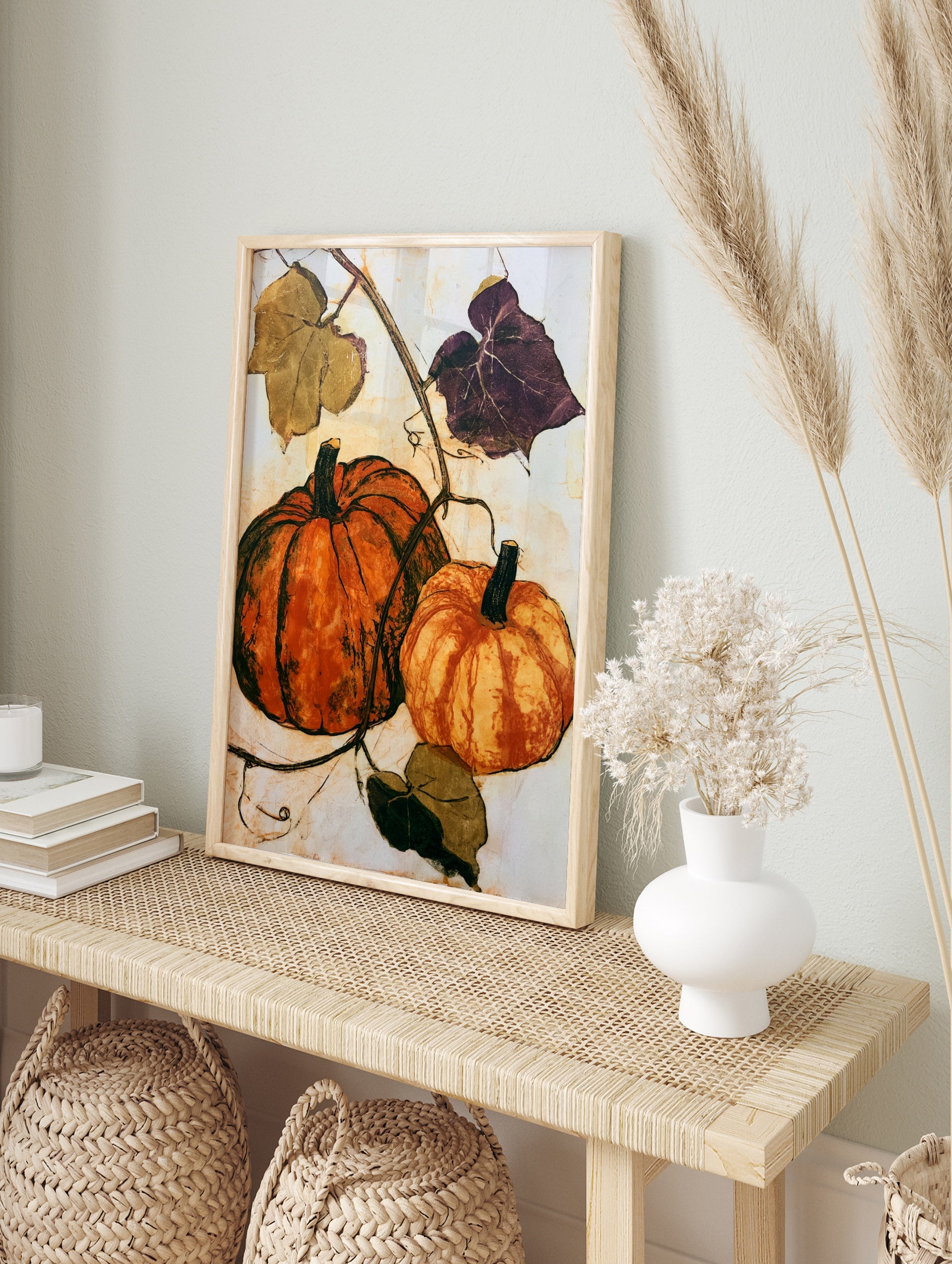 Pumpkin wall art featuring two orange gourds and botanical vines on a cream background, in an alternate framed mockup