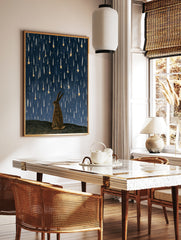 Illustrative rabbit silhouette gazing up at falling golden stars against a textured deep blue night, in a styled room mockup