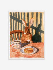 Illustration of a brown rabbit sitting at a table with coffee and a pastry, warm earthy tones, animal wall art print