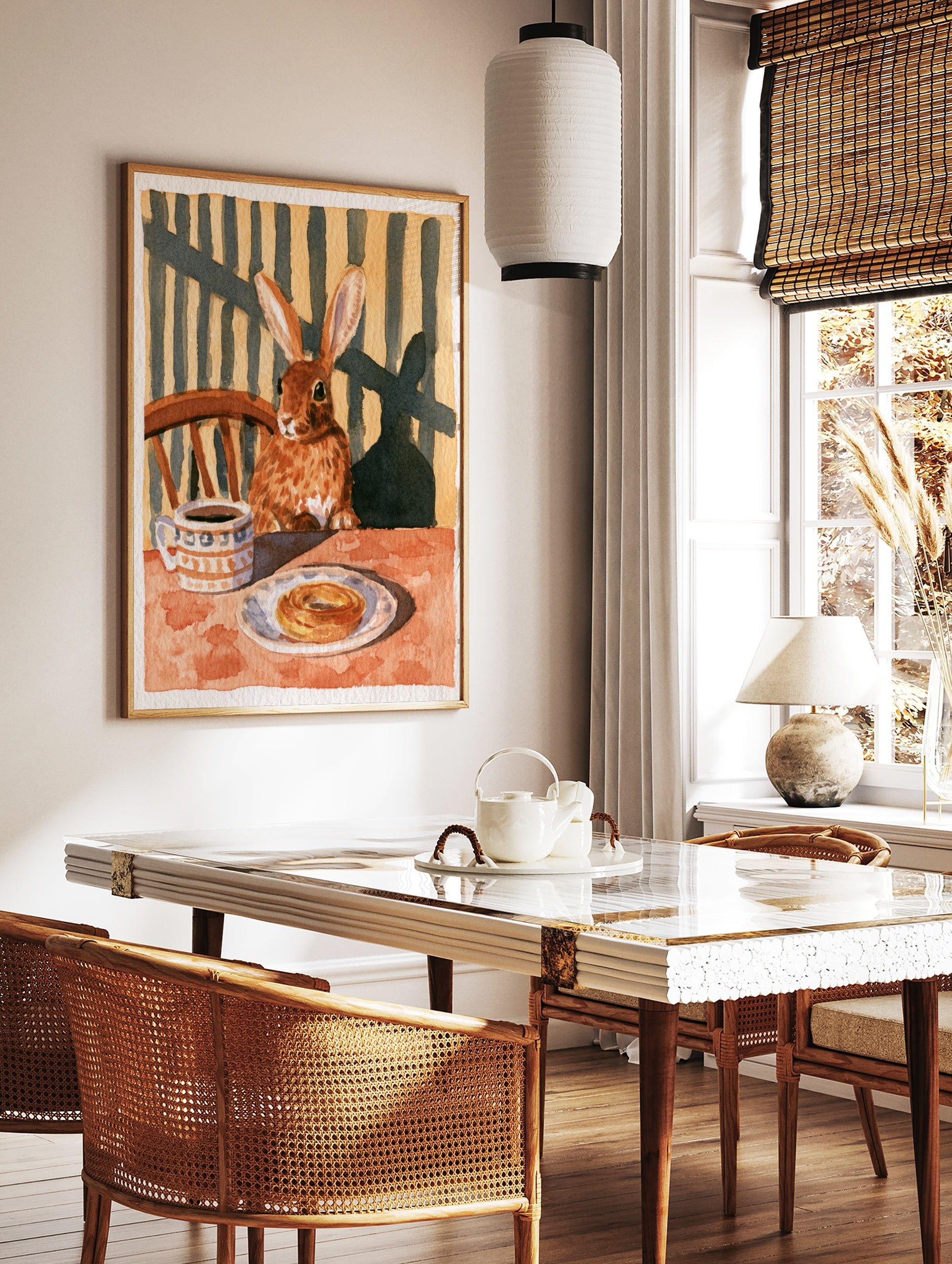 Illustration of a brown rabbit sitting at a table with coffee and a pastry, warm earthy tones, in a styled room mockup