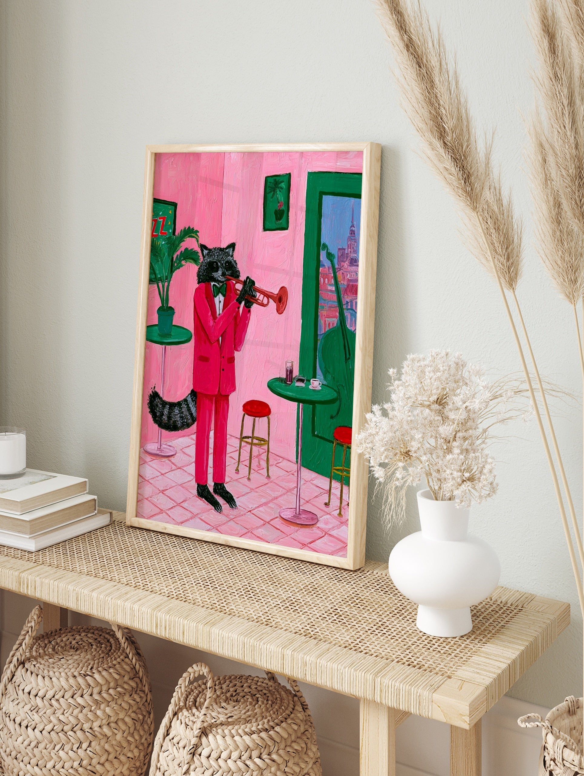 Raccoon in a pink suit playing a trumpet in a pink room with green furniture, illustrative, in an alternate framed mockup