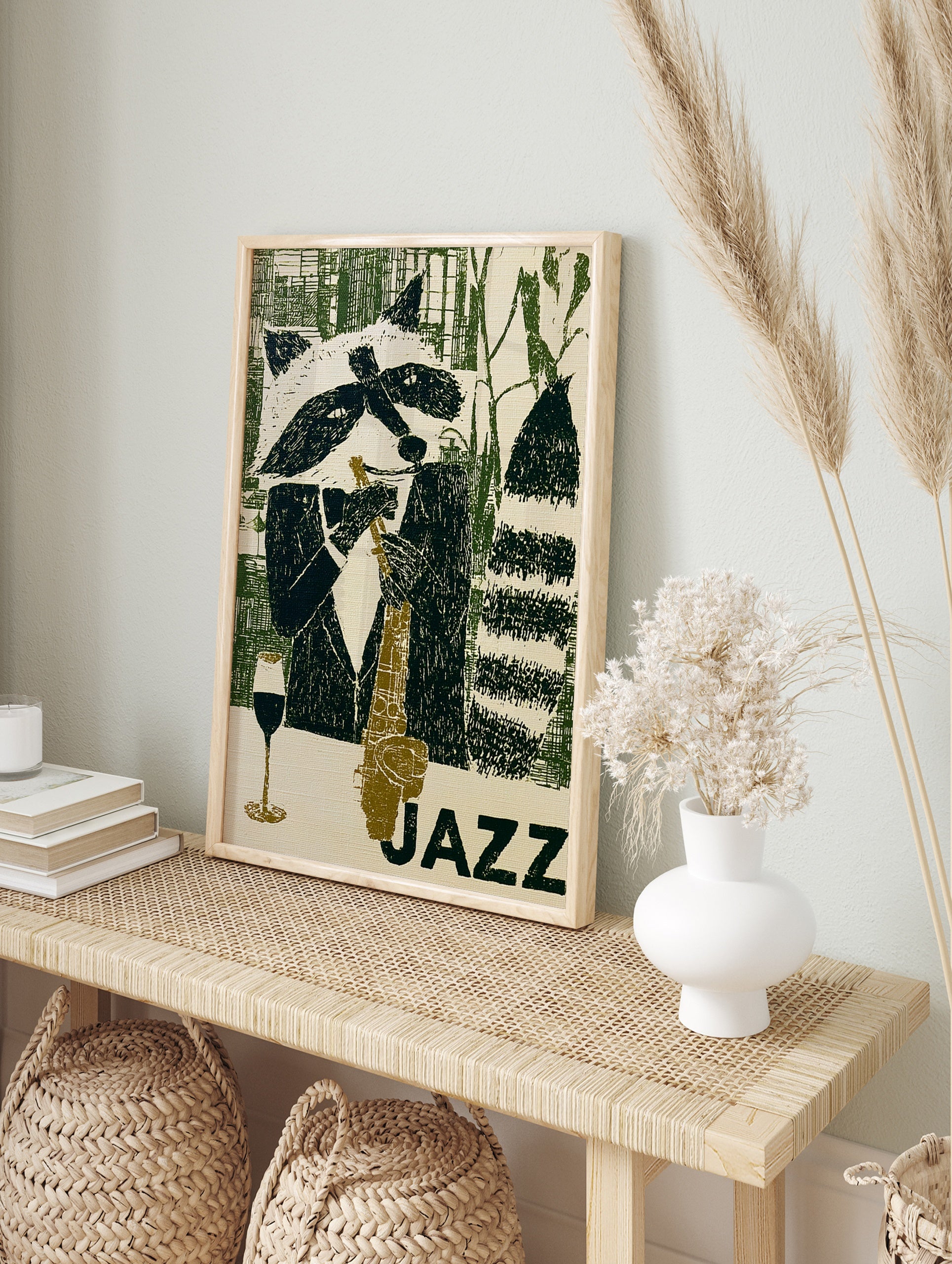 Illustration of a raccoon playing a saxophone with a wine glass, titled JAZZ in green and, in an alternate framed mockup