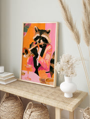 Raccoon in a tuxedo playing a trumpet with a cocktail on a table, orange and pink painterly, in an alternate framed mockup