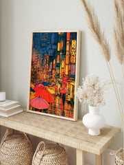 Anime style rainy city street illustration with colourful umbrellas and neon kanji signs at, in an alternate framed mockup