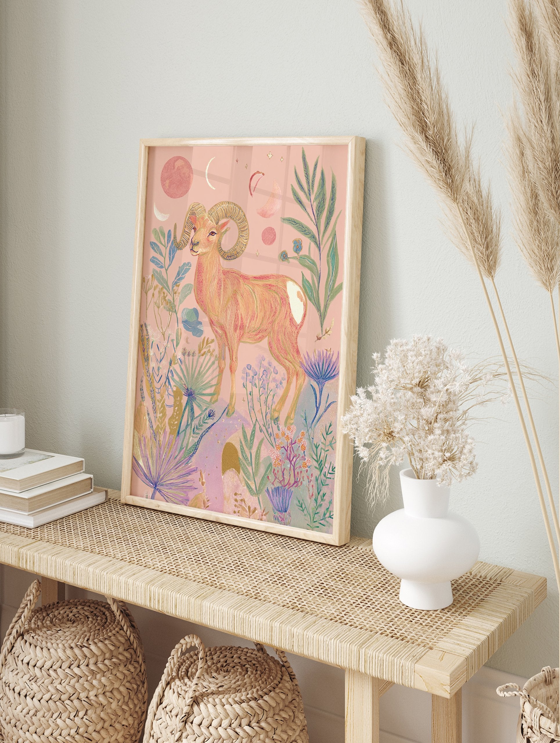Pink ram poster with large horns, surrounded by celestial moons, stars, and botanical plants on a light pink background. - Image 4