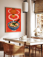 Ramen bowl illustration with a hanging lantern and chopsticks on a vibrant red background, in a styled room mockup