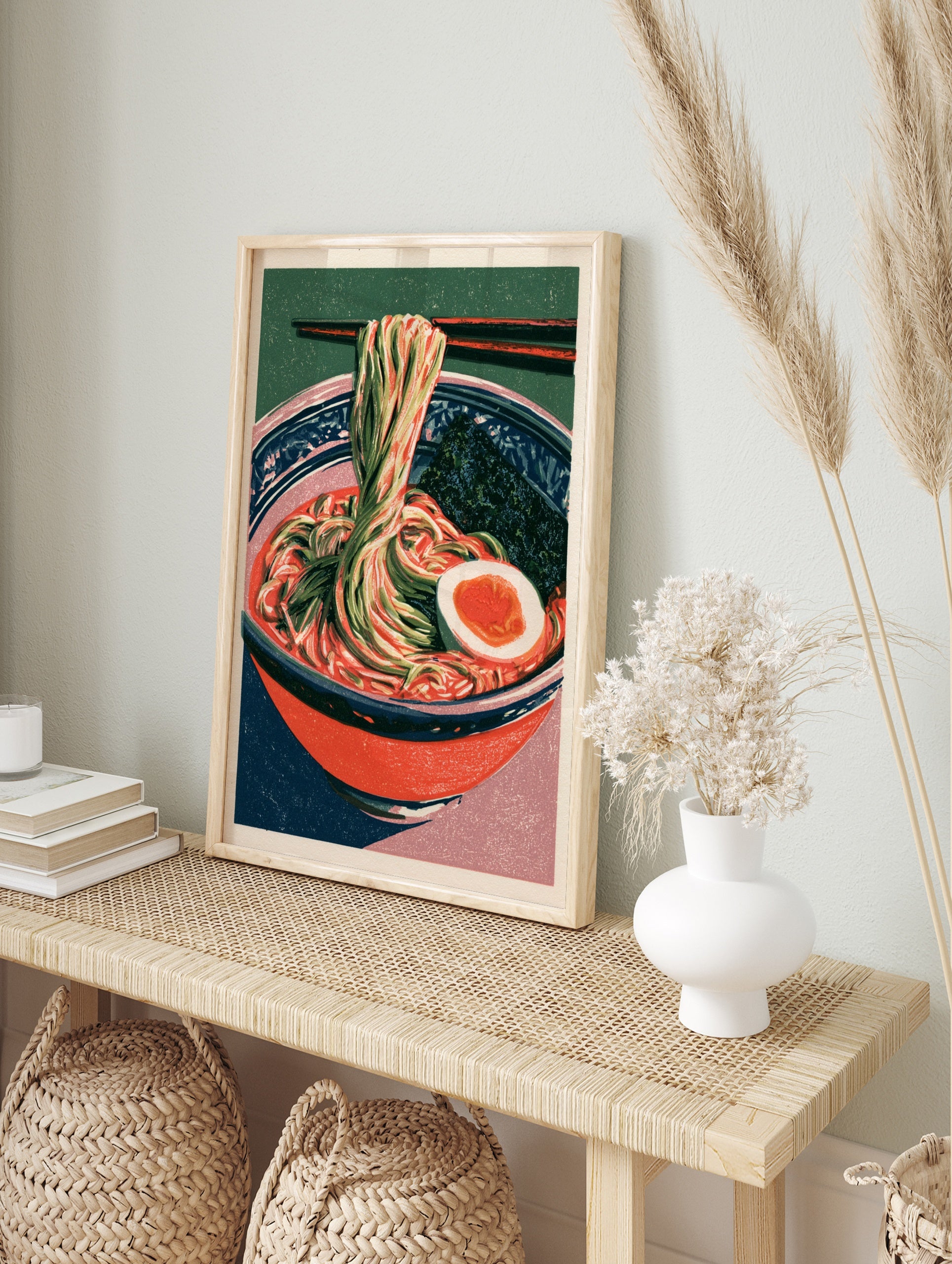 Ramen bowl art print with noodles, egg, and nori in a red bowl against a green background, in an alternate framed mockup