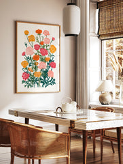 Botanical illustration of vibrant pink, orange, and yellow Ranunculus flowers with green leaves on, in a styled room mockup