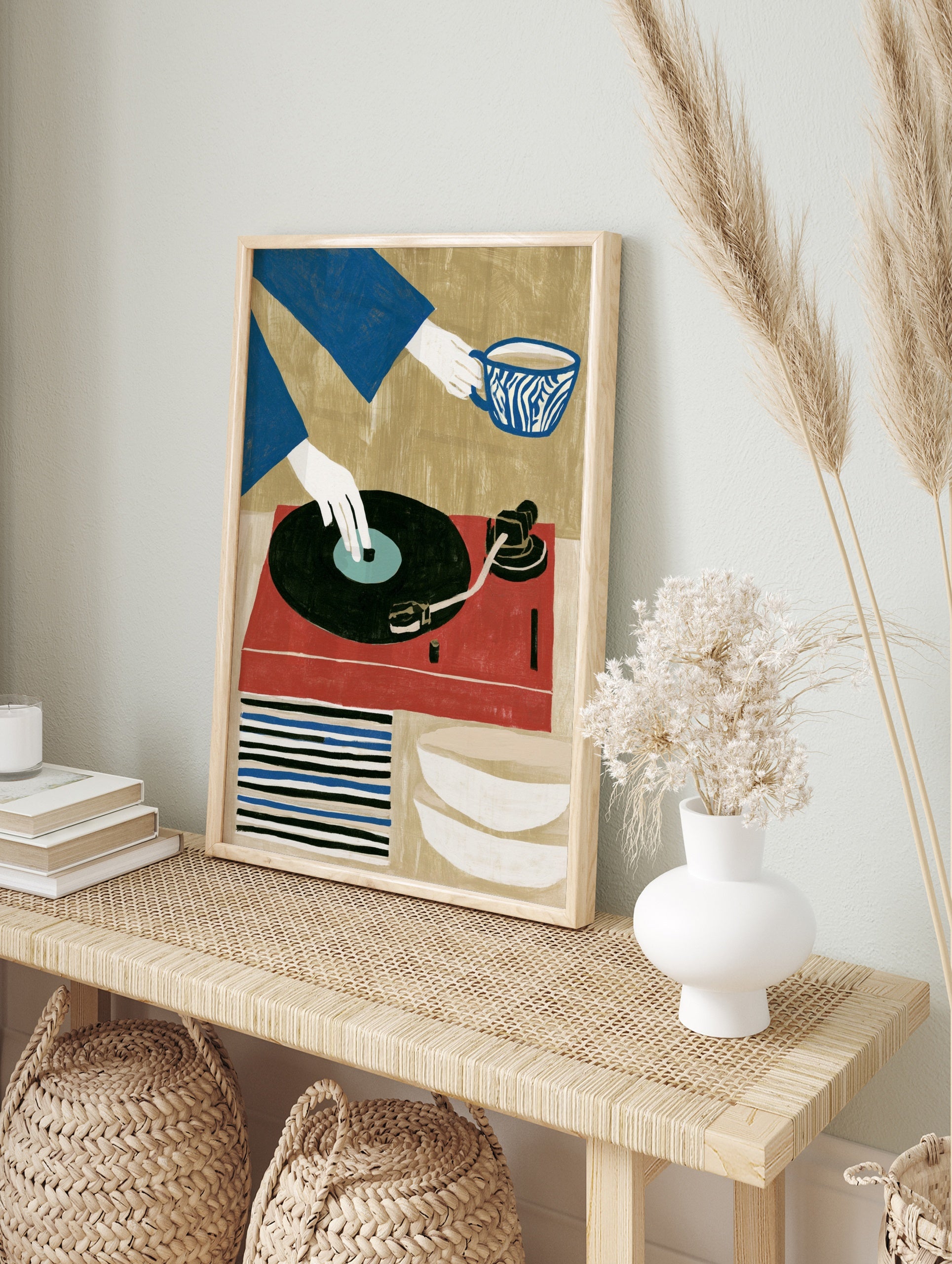 Graphic illustration of a hand on a vinyl record player and a person holding a patterned cup, in an alternate framed mockup