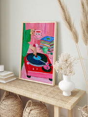 A vibrant painterly illustration of a red record player, a stack of vinyls, and a hand, in an alternate framed mockup