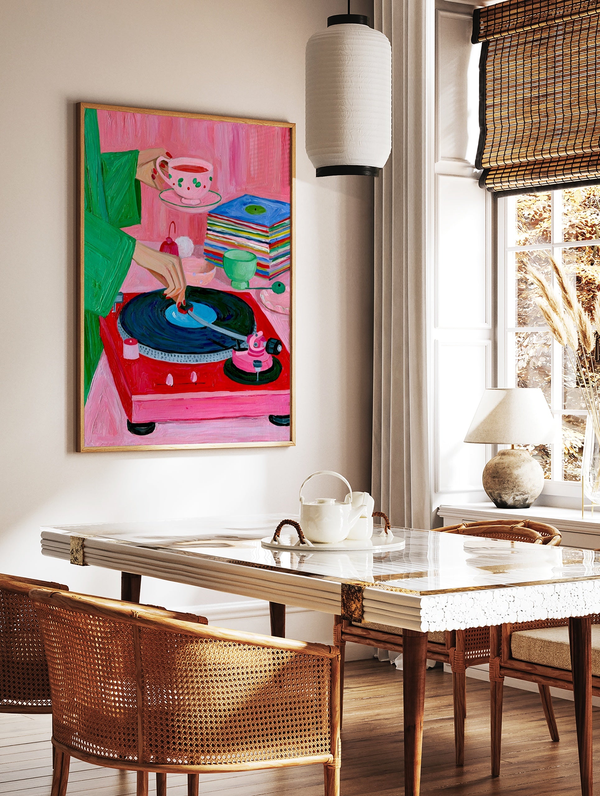 A vibrant painterly illustration of a red record player, a stack of vinyls, and a hand holding a, in a styled room mockup
