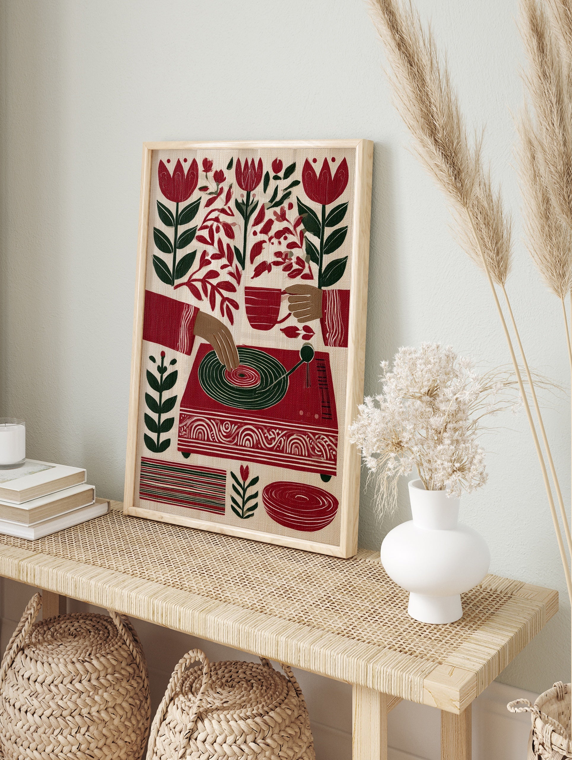 Illustration of hands playing a record player with red tulips and botanical leaves on a cream, in an alternate framed mockup