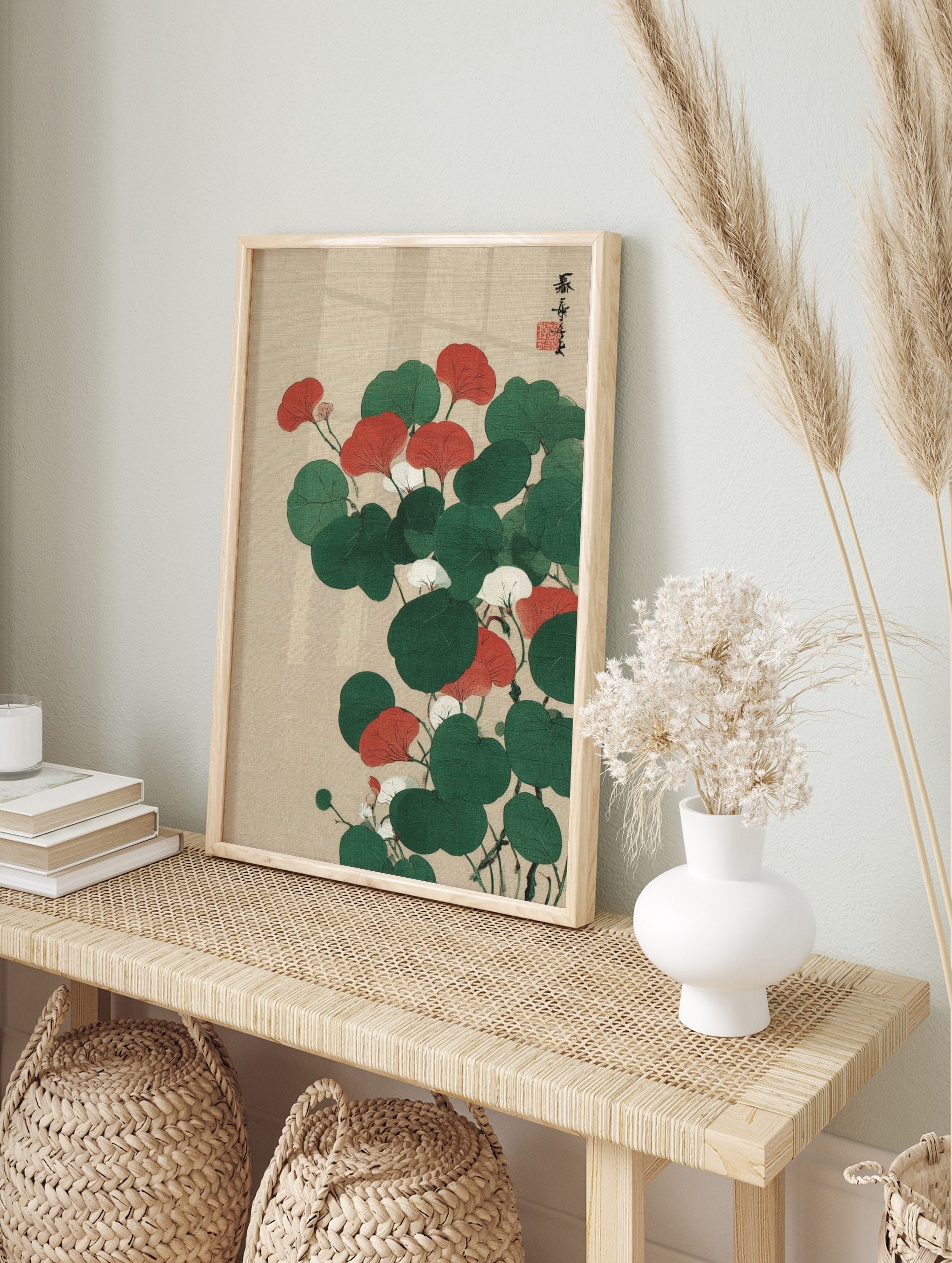 Red and green botanical illustration with white flowers and Japanese calligraphy on a beige, in an alternate framed mockup