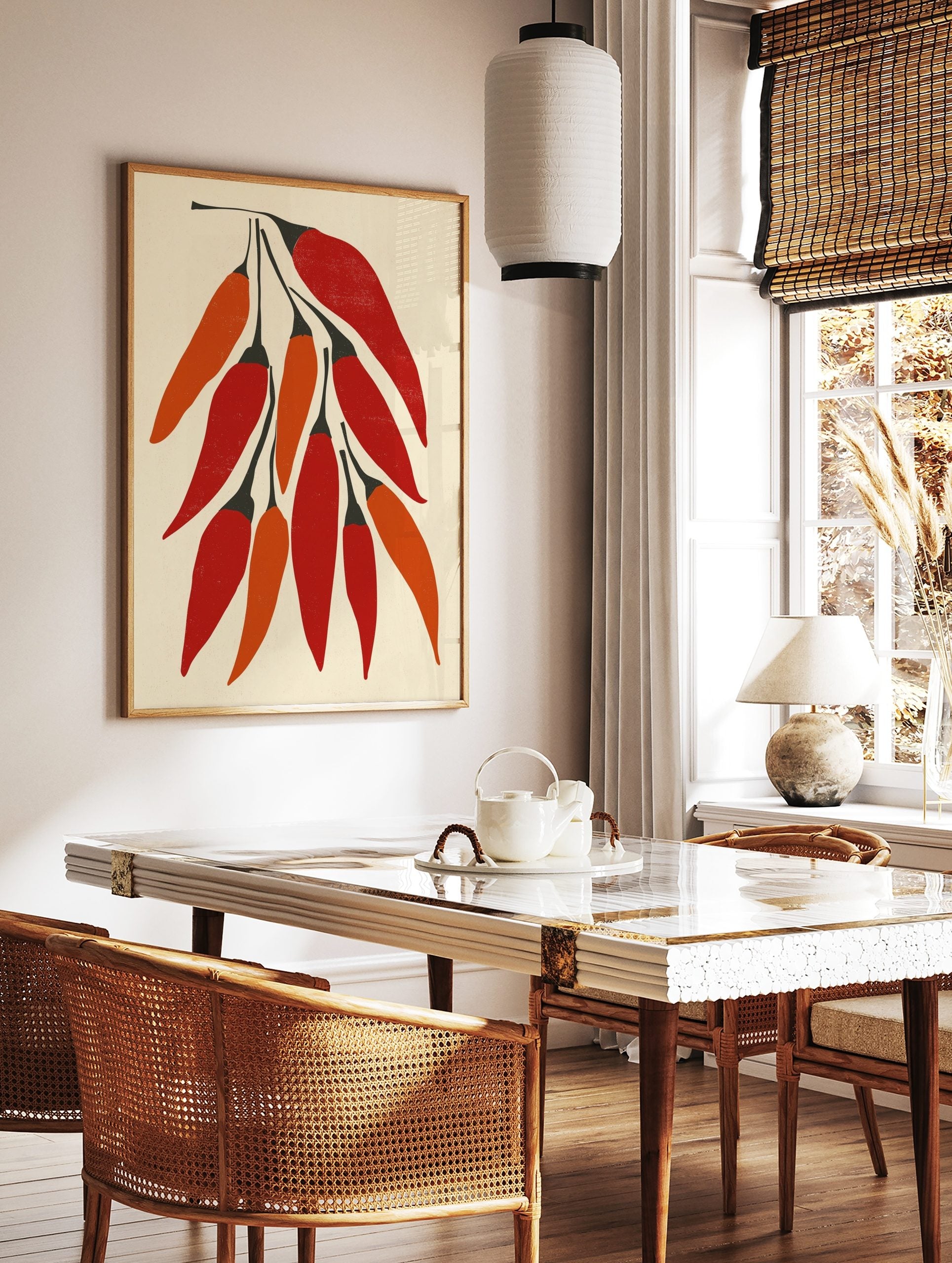 Illustrative print of ten red and orange chilli peppers with black stems on a light beige background, in a styled room mockup