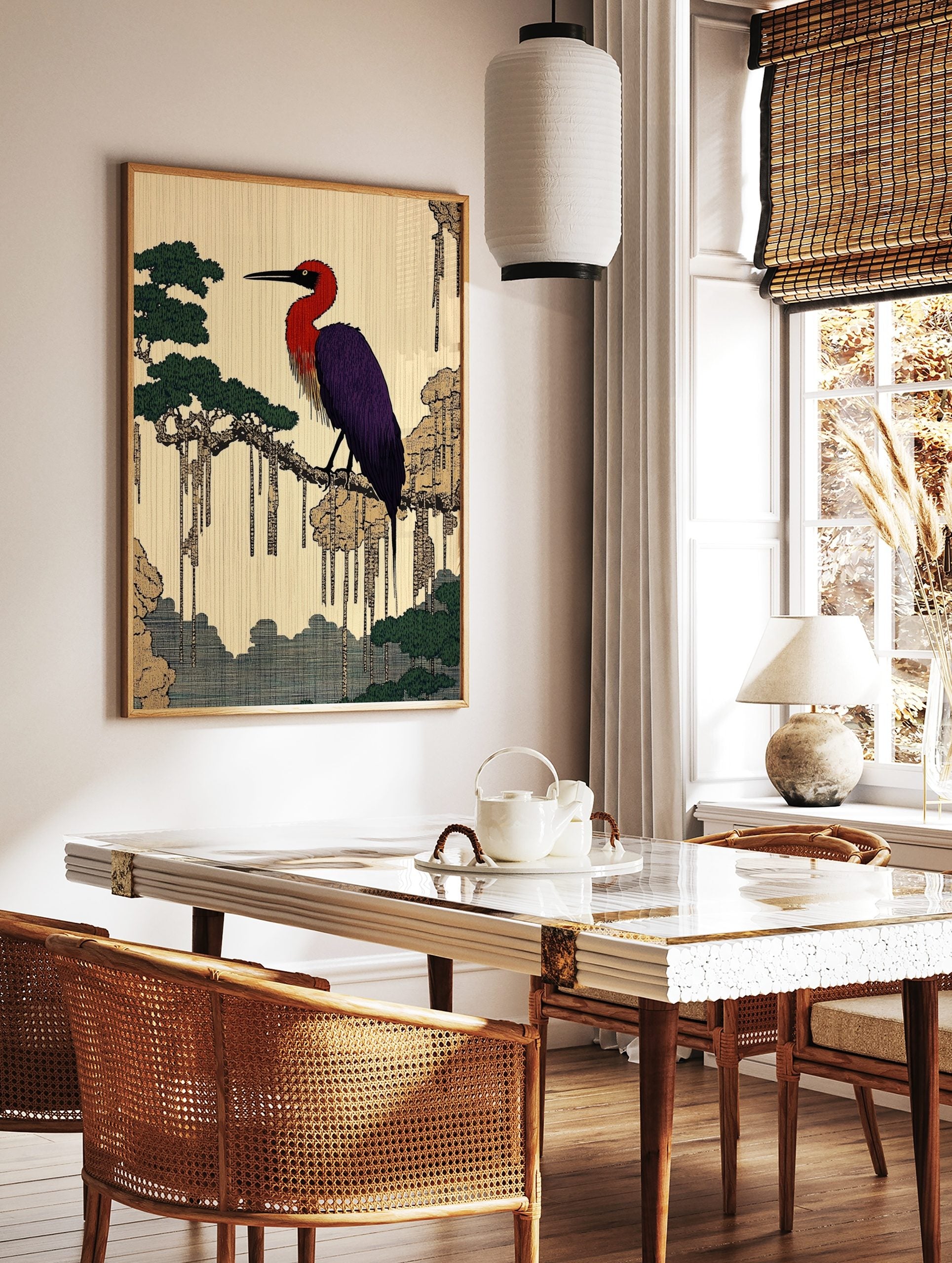 Japanese illustrative print of a red and purple heron on a tree branch with green foliage and, in a styled room mockup