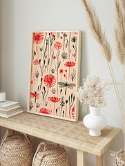 Red botanical flowers, berries, and black dragonflies illustrative pattern on a light beige, in an alternate framed mockup