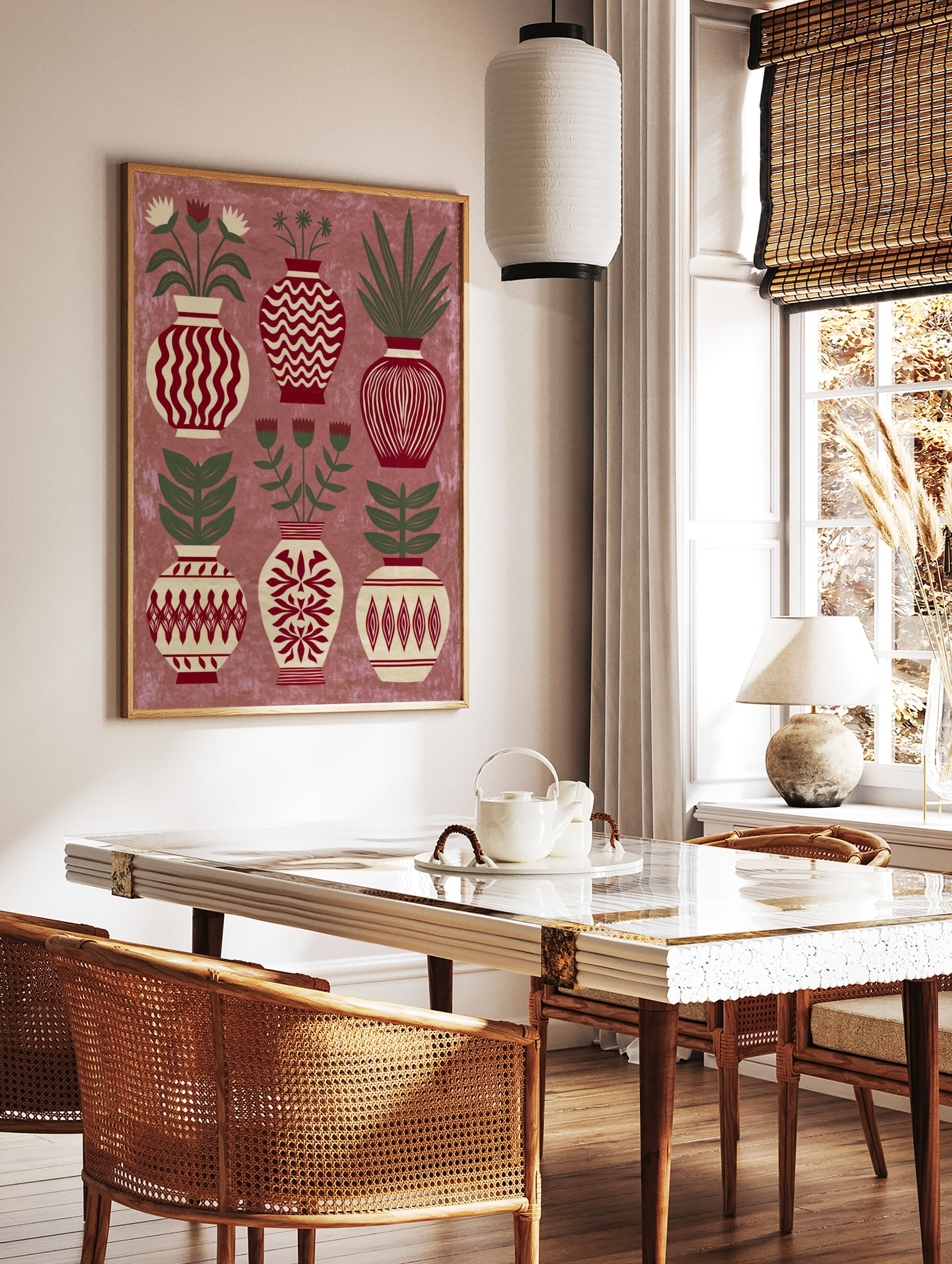 Decorative folk art print showing six patterned vases with botanical flowers and leaves in red, in a styled room mockup