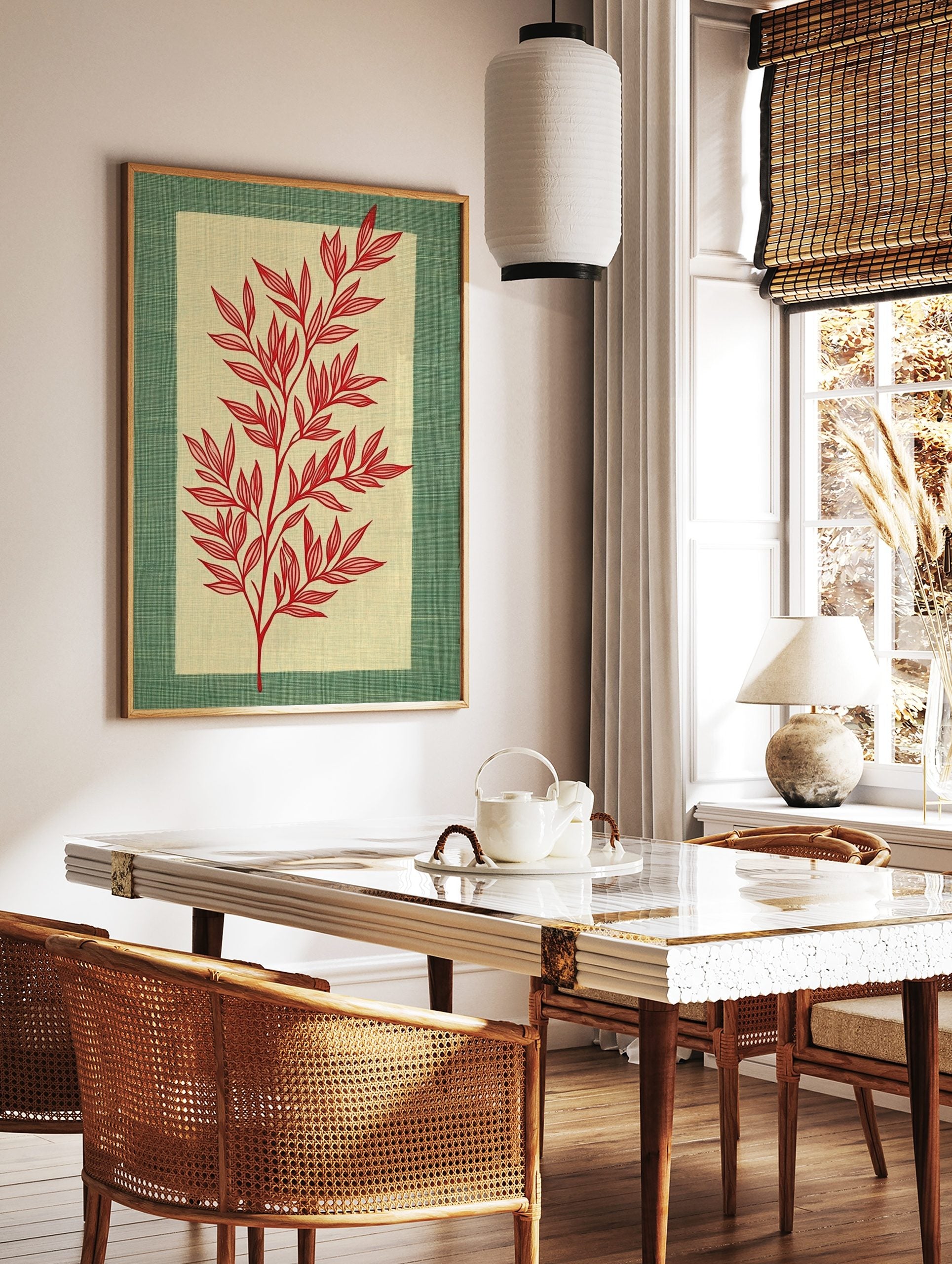 Red botanical illustration of a leafy stem on a pale beige panel, framed by a textured green border, in a styled room mockup