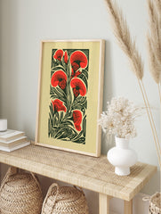 Red carnation flowers and dark green leaves in a graphic woodcut style botanical art print, in an alternate framed mockup