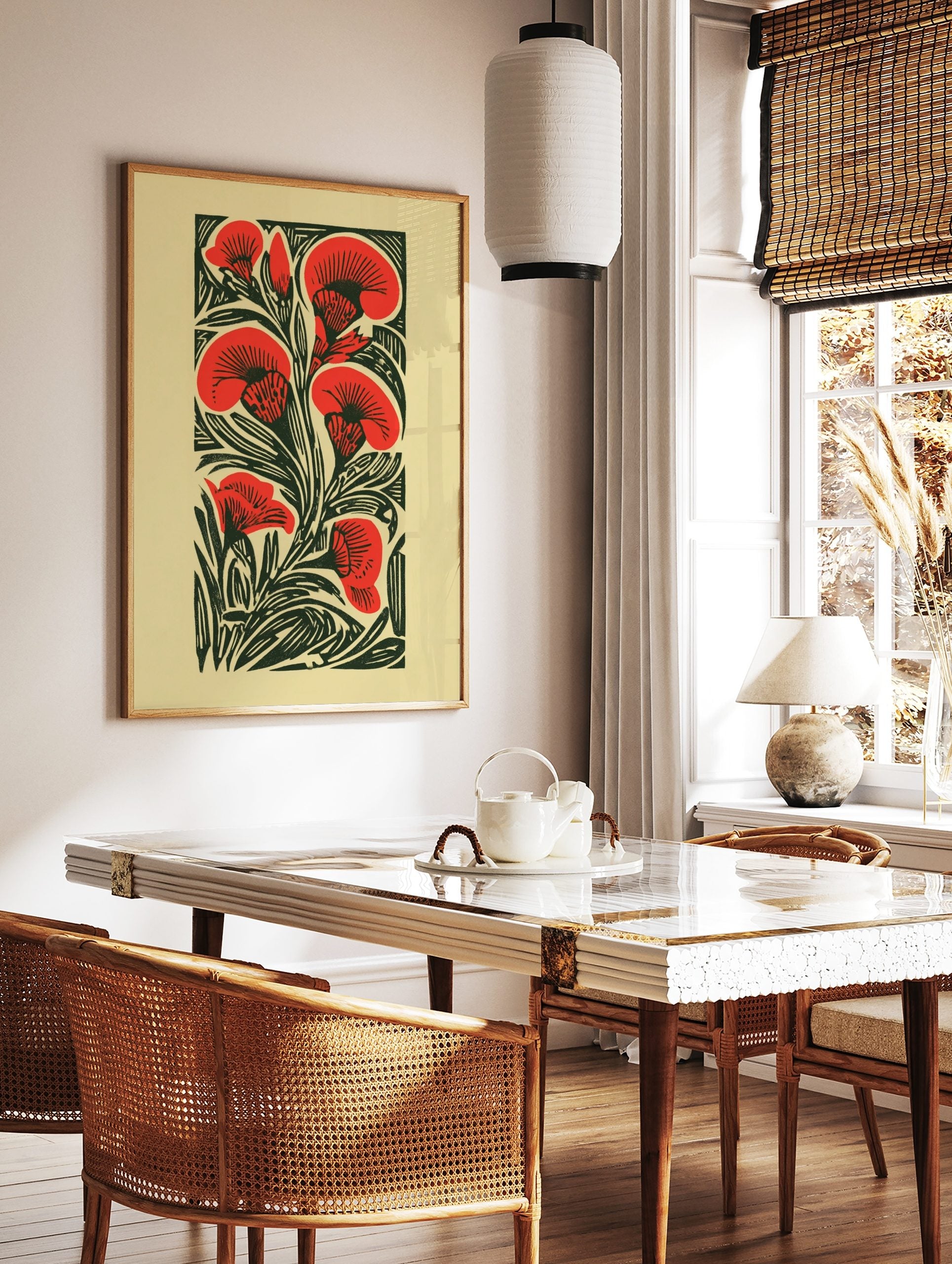 Red carnation flowers and dark green leaves in a graphic woodcut style botanical art print, in a styled room mockup