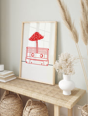 Minimalist red line art illustration of a cassette tape with a mushroom canopy on a white, in an alternate framed mockup