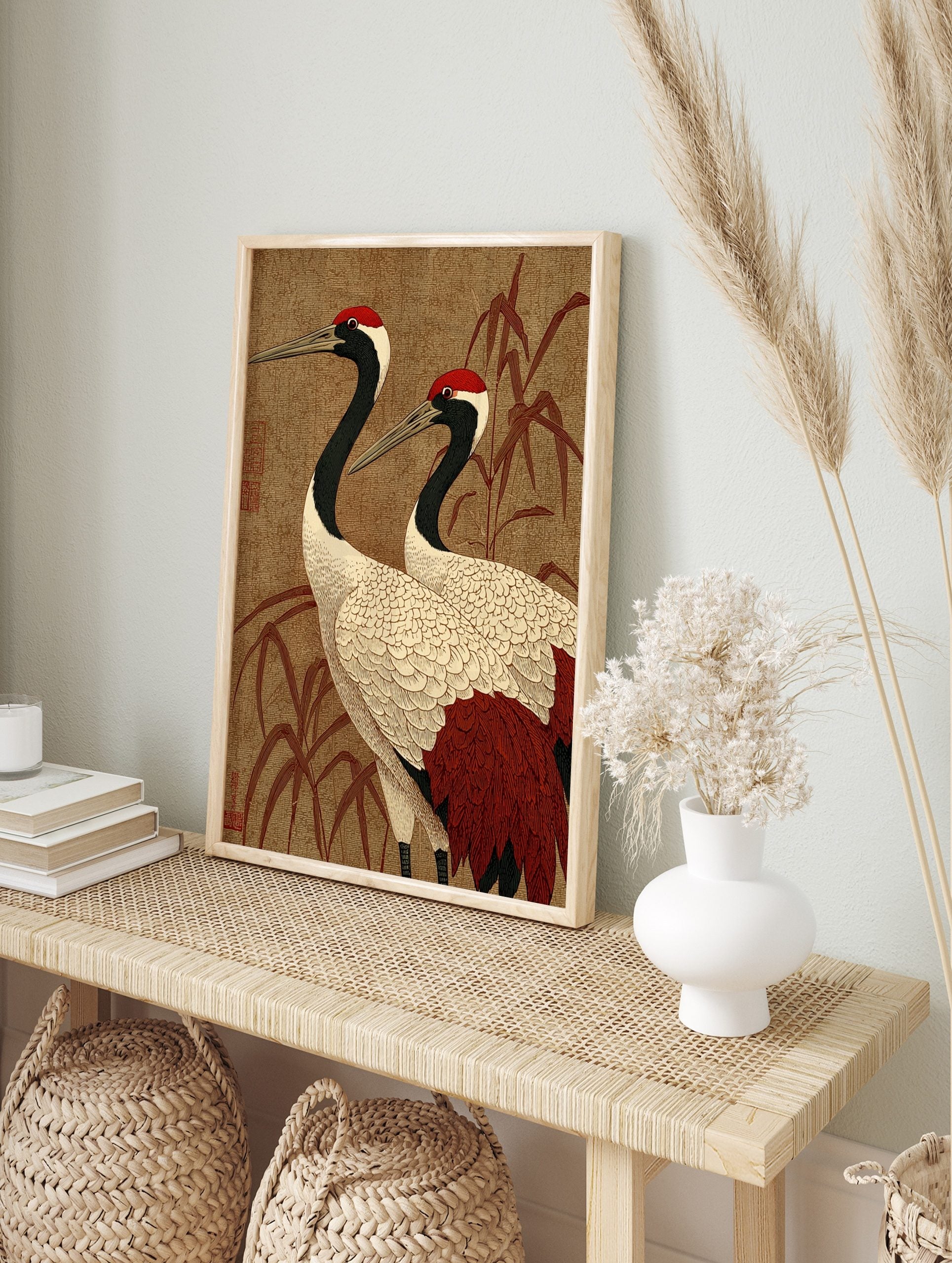 Japanese Red-Crowned Crane art print with two cranes and bamboo on a textured brown background, in an alternate framed mockup