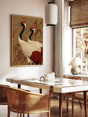 Japanese Red-Crowned Crane art print with two cranes and bamboo on a textured brown background, in a styled room mockup