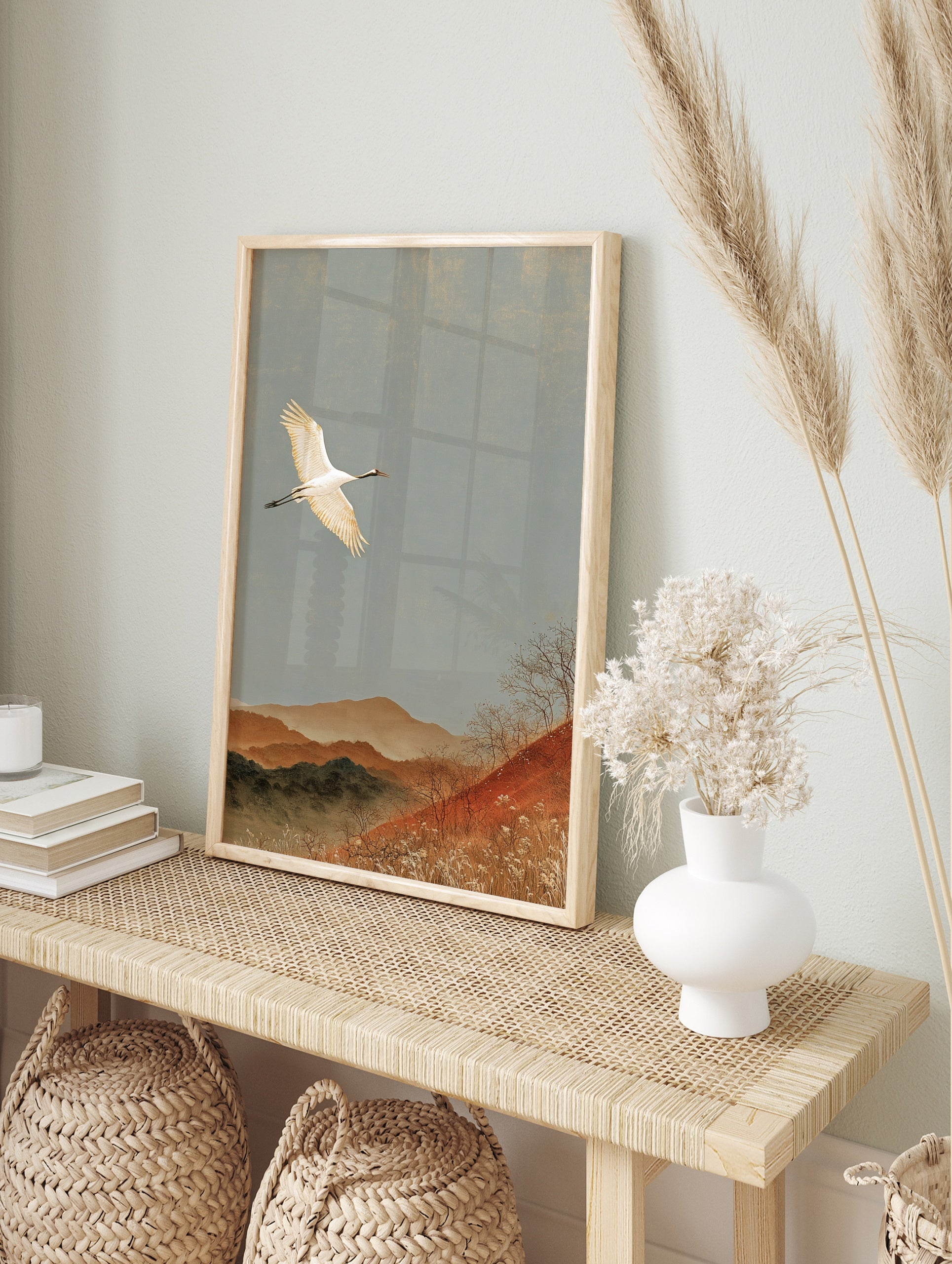 Red-crowned crane flying over autumn mountains in a Japanese style art print on matte paper, in an alternate framed mockup