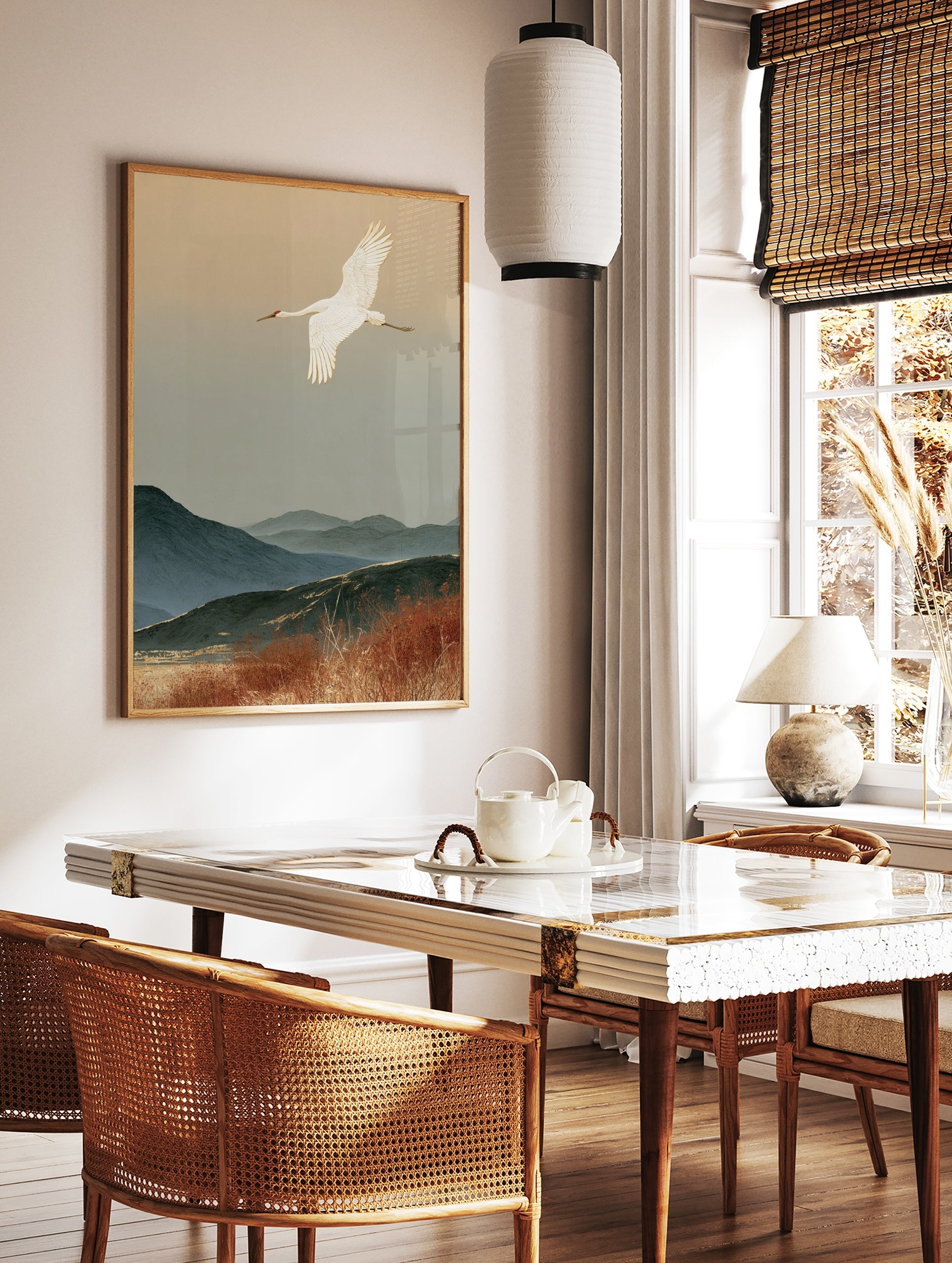 Red-crowned crane flying over misty blue mountains and autumn reeds in a Japanese-style art print, in a styled room mockup