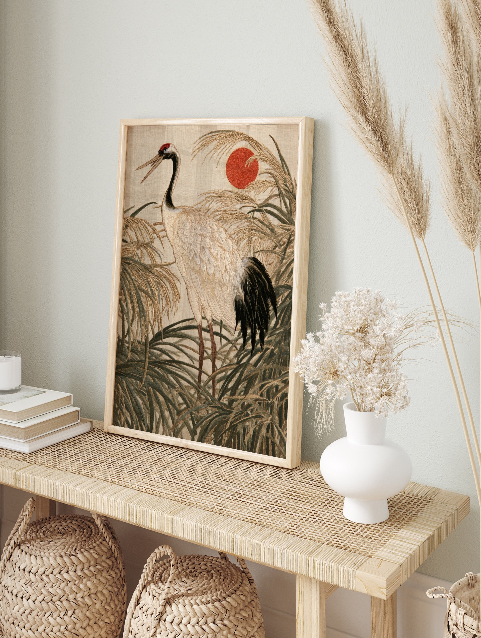 Japanese red-crowned crane embroidery art print with rising sun and tall grasses in neutral, in an alternate framed mockup