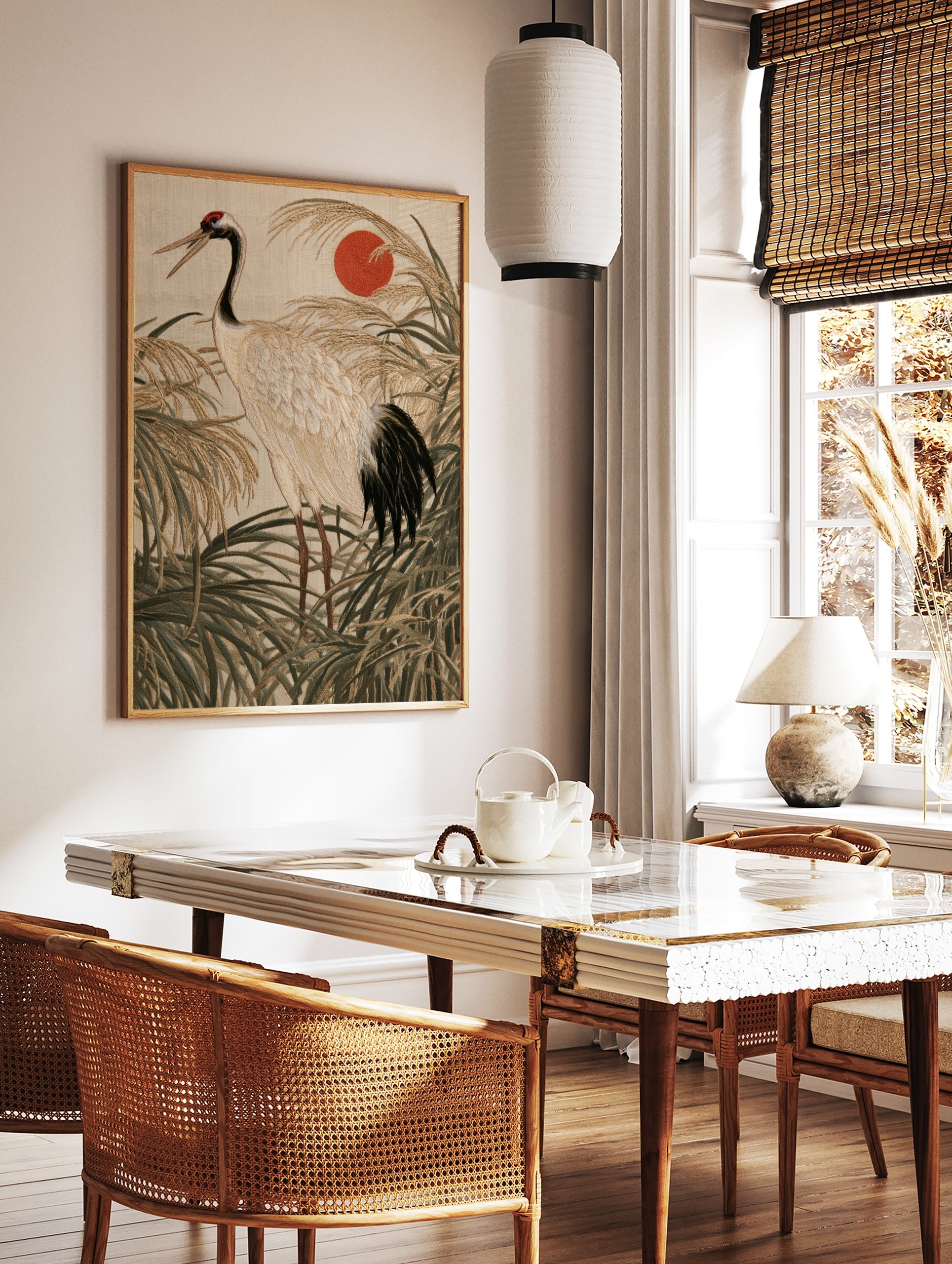 Japanese red-crowned crane embroidery art print with rising sun and tall grasses in neutral tones, in a styled room mockup