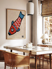 Stylised red fish illustration with white scales and blue fins on a tan paper background, in a styled room mockup