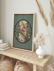 Red flower branch botanical illustration in a circular frame with geometric background, in an alternate framed mockup