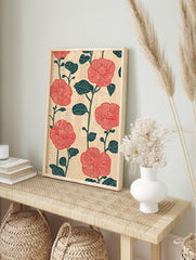 Red flower botanical pattern print with dark teal leaves and stems on a light beige textured, in an alternate framed mockup