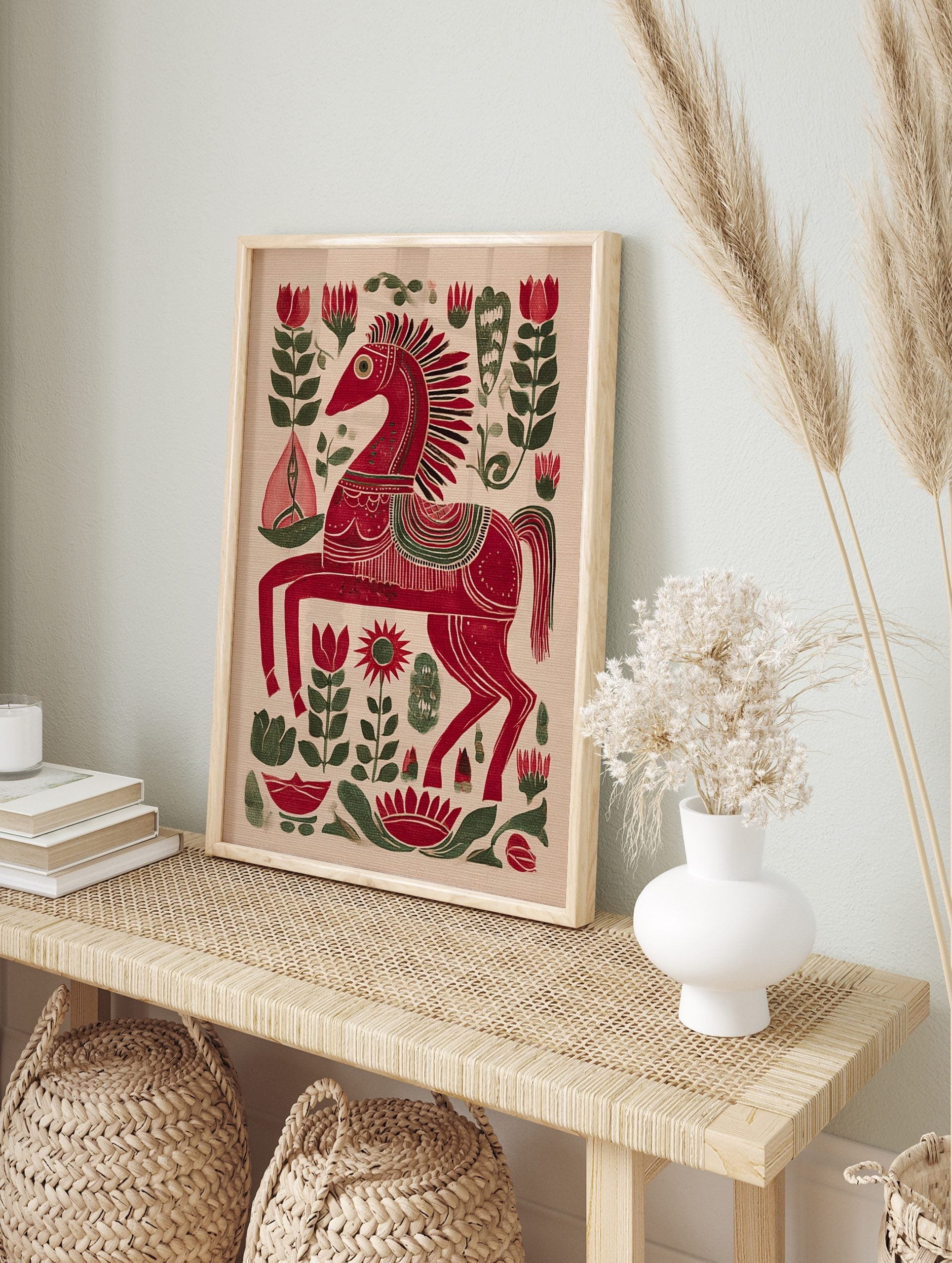 Red folk art horse print with intricate white and green patterns, surrounded by red and green, in an alternate framed mockup