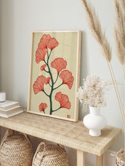 Red ginkgo leaves with a dark green branch botanical illustration on a cream background, in an alternate framed mockup