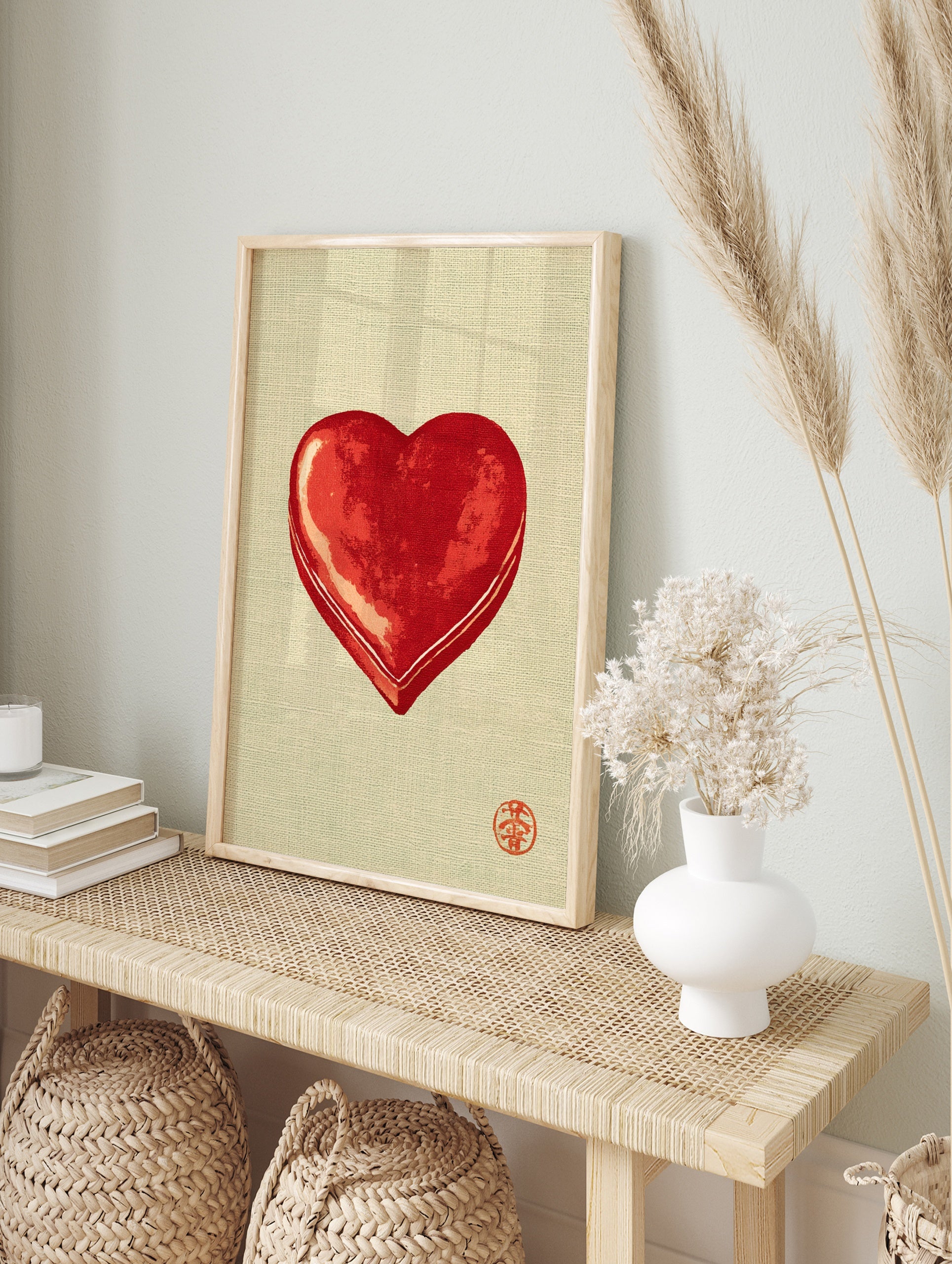Minimalist red heart illustration with traditional red seal on a textured beige background, in an alternate framed mockup