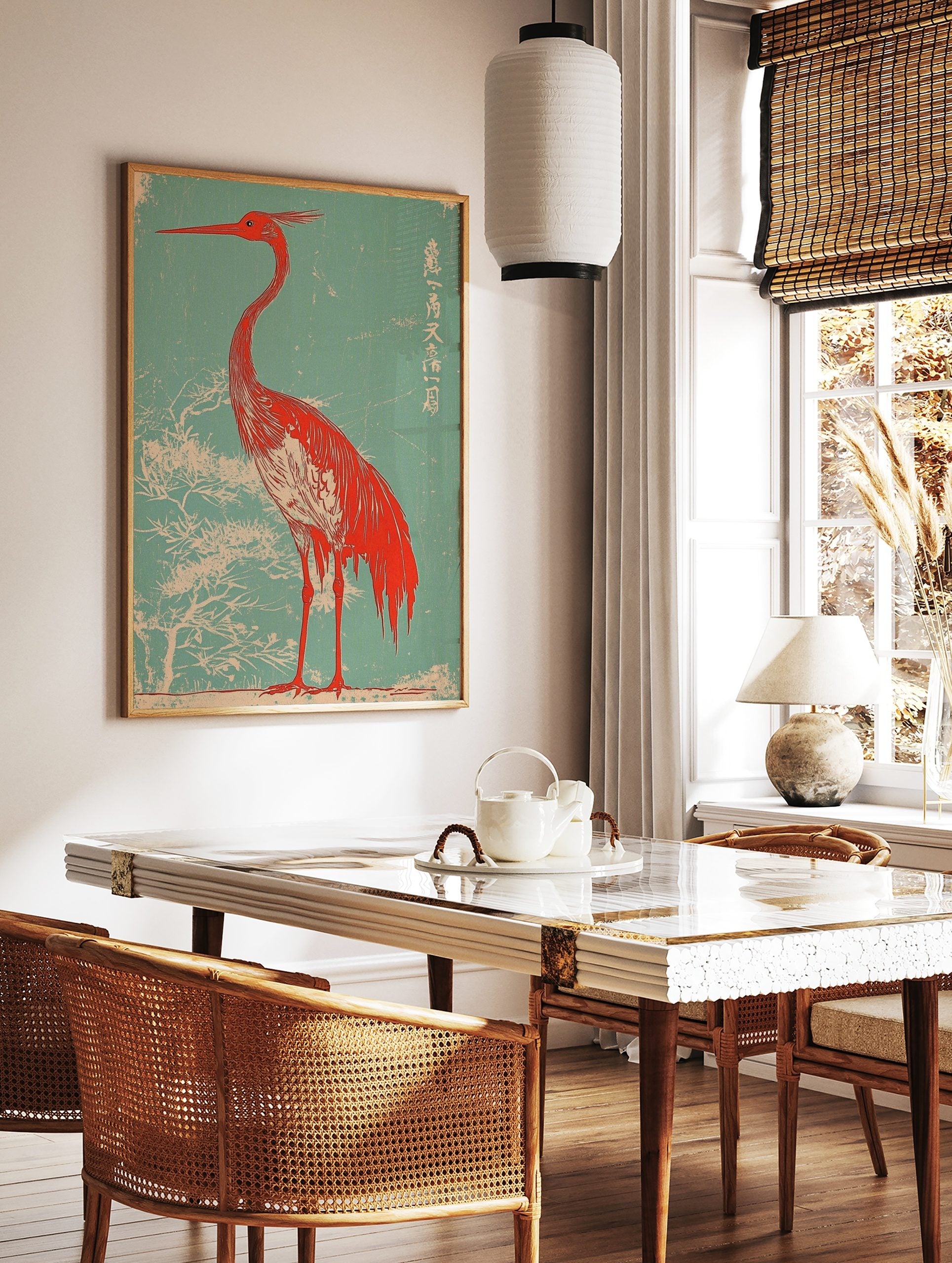 Red heron with long beak and crest, against a teal background with white tree branches and Japanese, in a styled room mockup