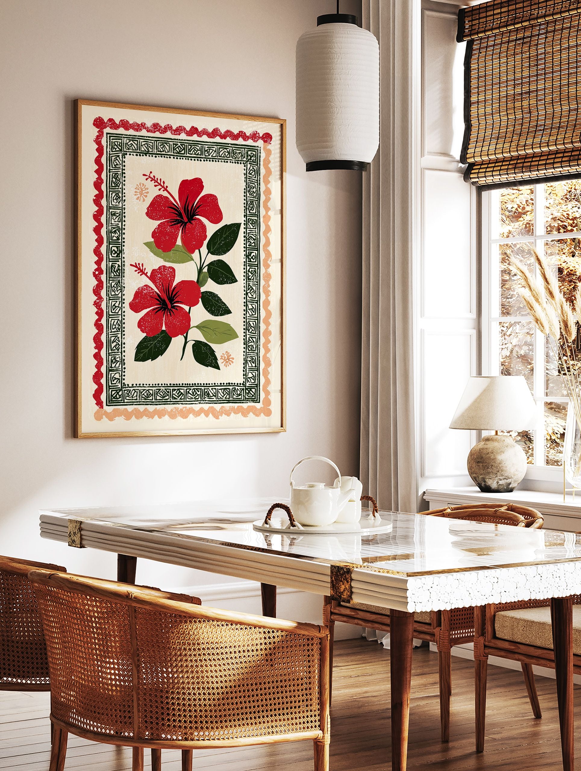 Red hibiscus wall art print with two vibrant flowers, green leaves, and decorative folk art borders on a cream background. - Image 3