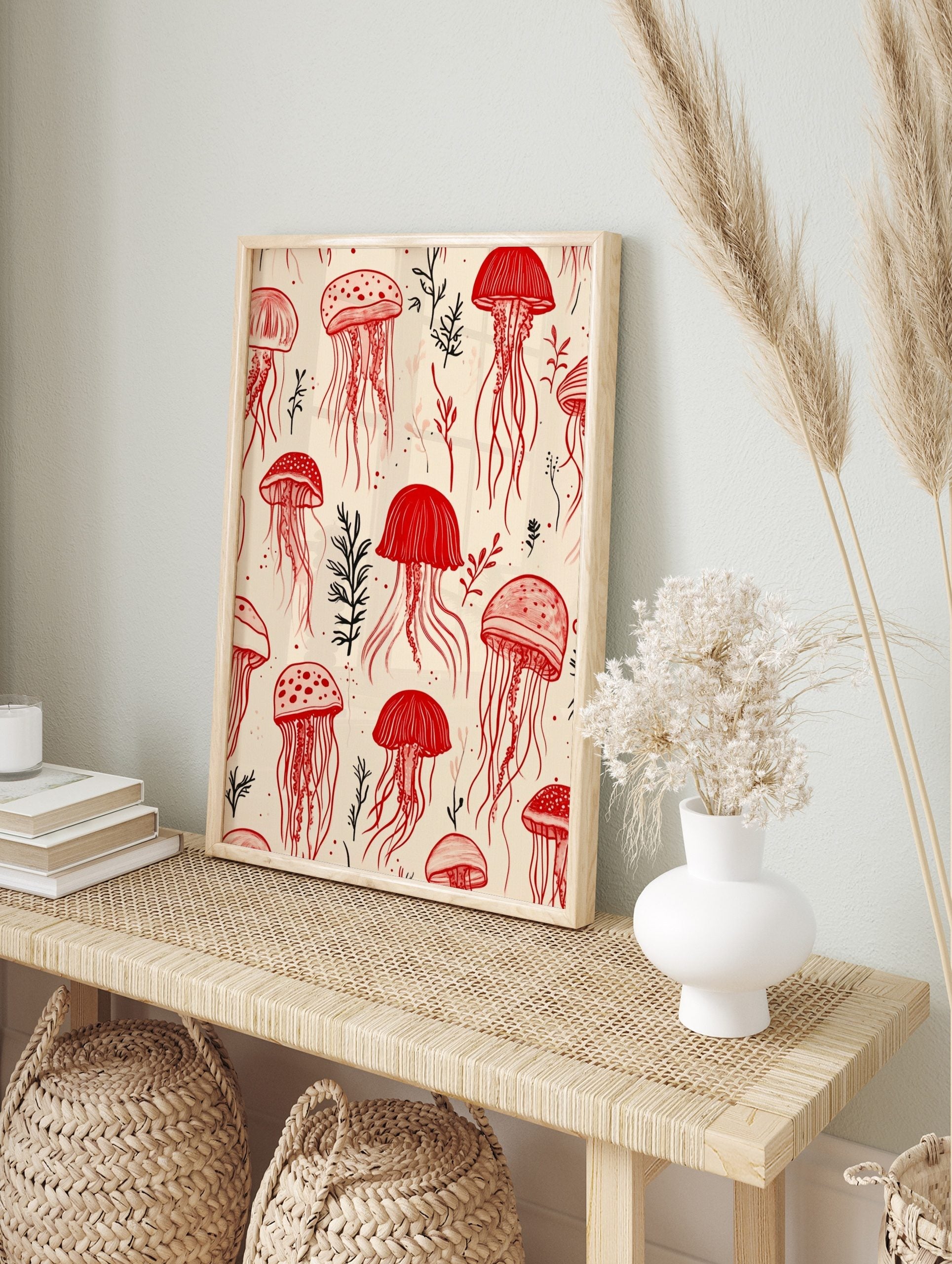Seamless pattern of red jellyfish and black and red marine plants on a light beige, in an alternate framed mockup