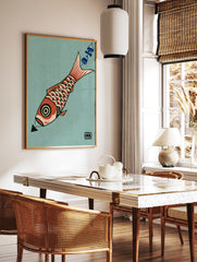 Graphic illustration of a red koi fish with a circular eye and scale pattern on a teal background, in a styled room mockup
