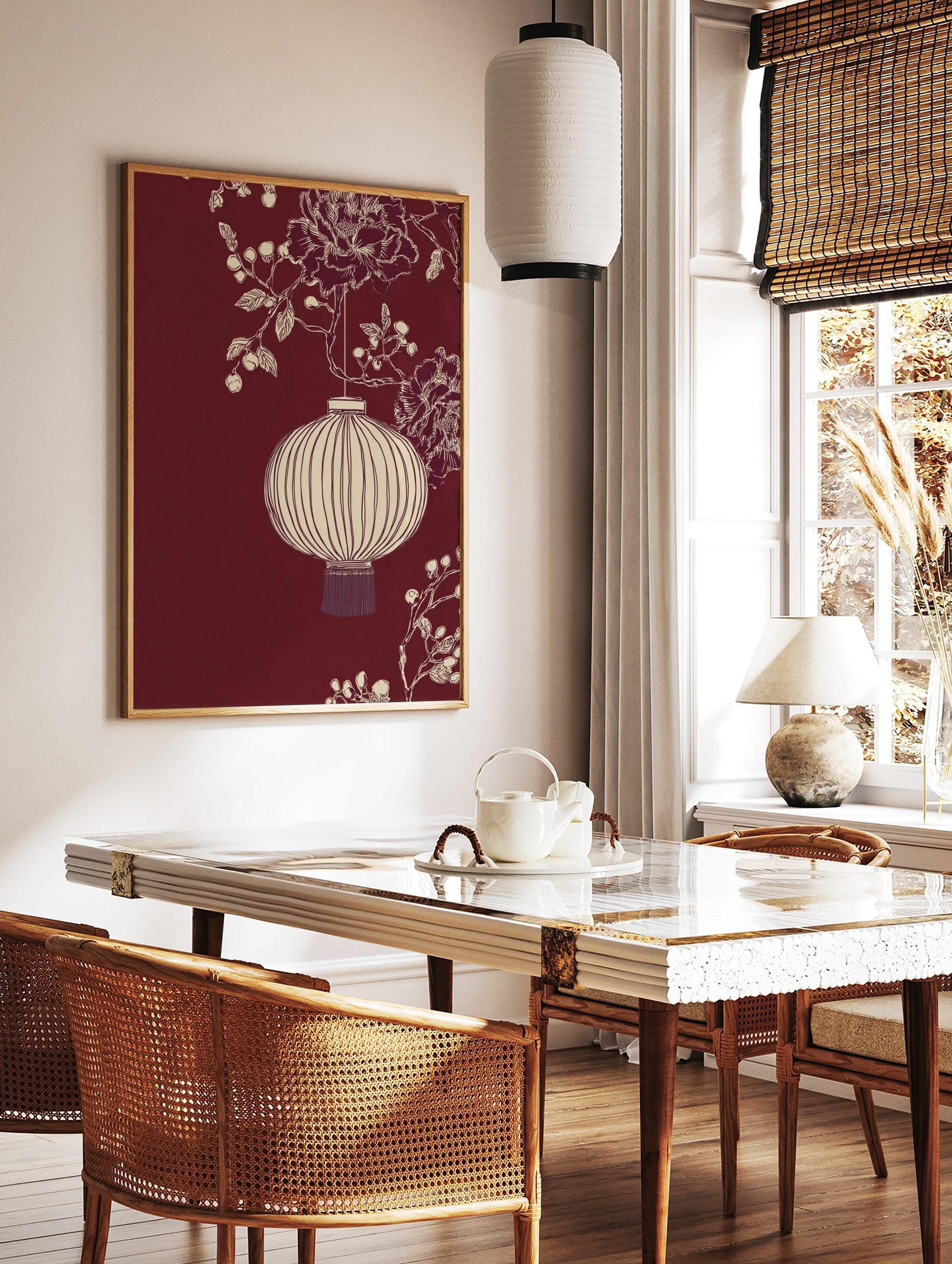 Illustrative off-white Chinese lantern with peonies and berries on a deep red background, in a styled room mockup