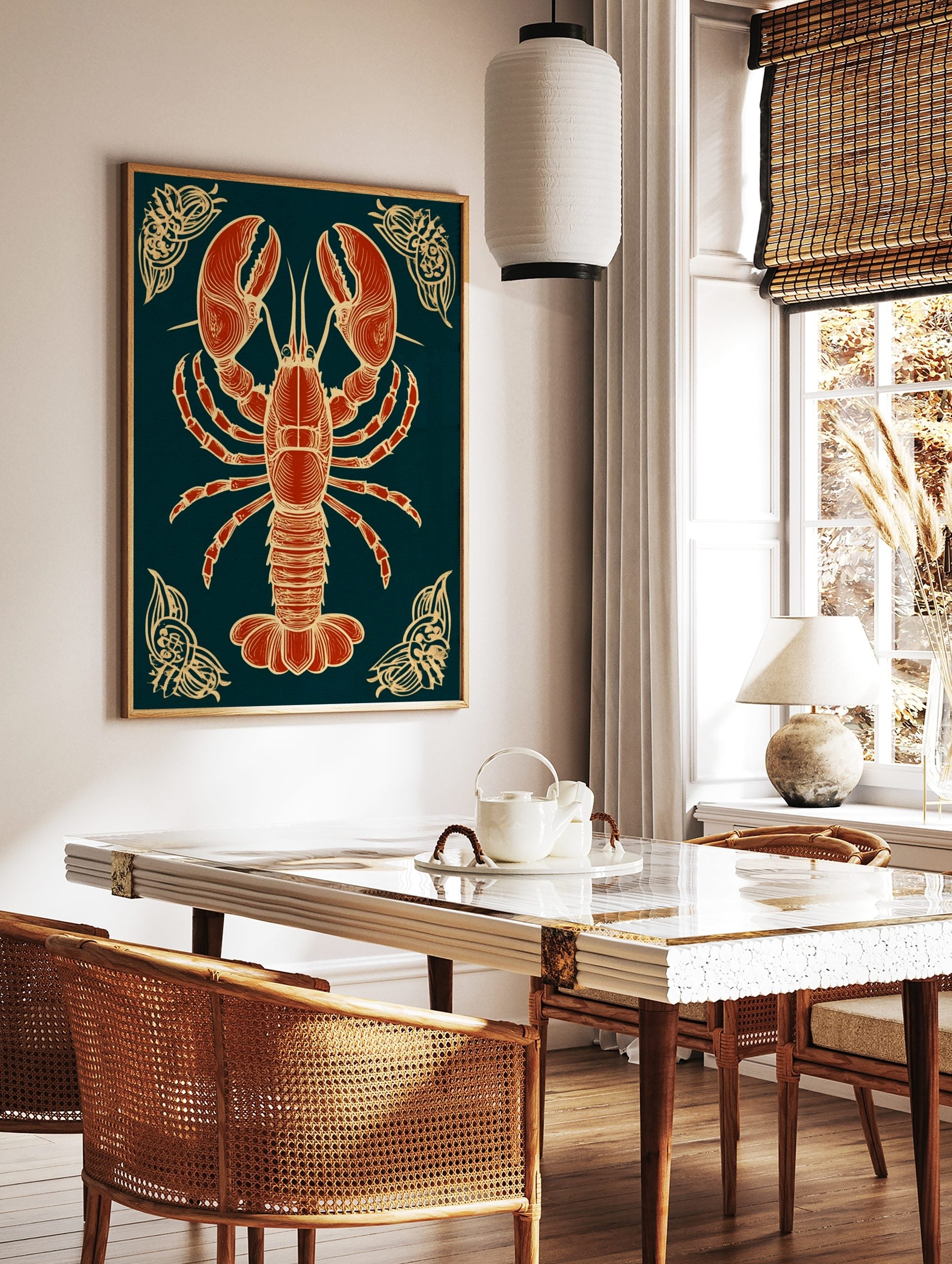 Red lobster illustration with beige-gold outlines on a dark navy background, with ornate corner, in a styled room mockup