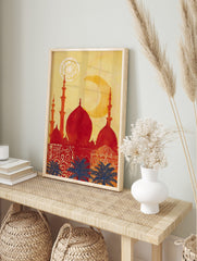 Red mosque silhouette with domes and minarets against a yellow sky, blue palm trees, and a, in an alternate framed mockup