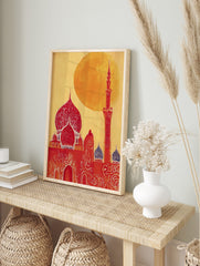 Illustrative red mosque with ornate domes and a tall minaret against a bright yellow-orange, in an alternate framed mockup