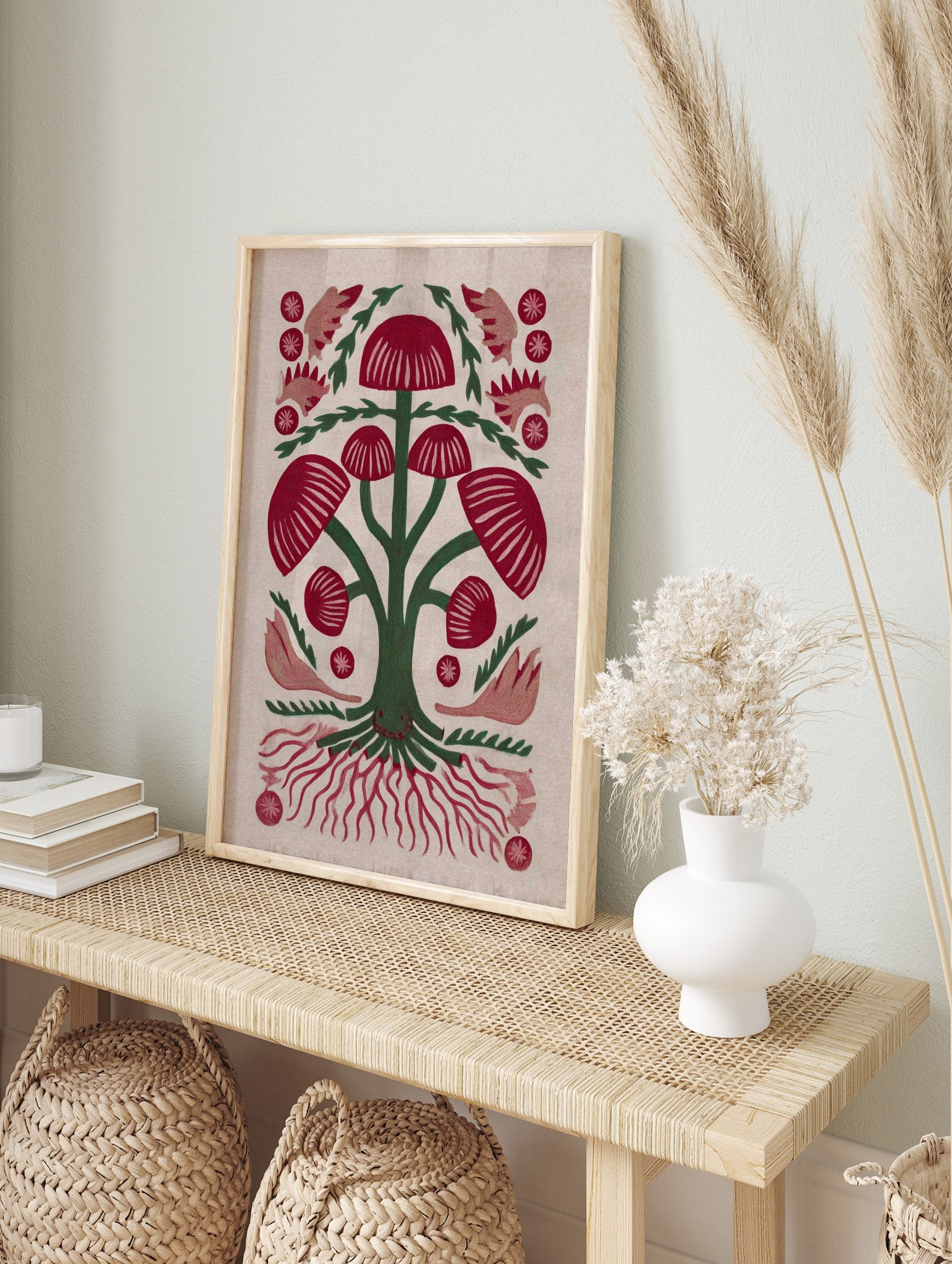 Red mushroom botanical illustration with green stems and roots, folk art style on light, in an alternate framed mockup