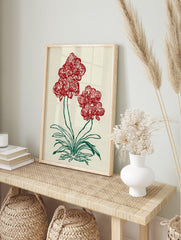 Red orchid flower botanical illustration art print with green stems and leaves on a light, in an alternate framed mockup