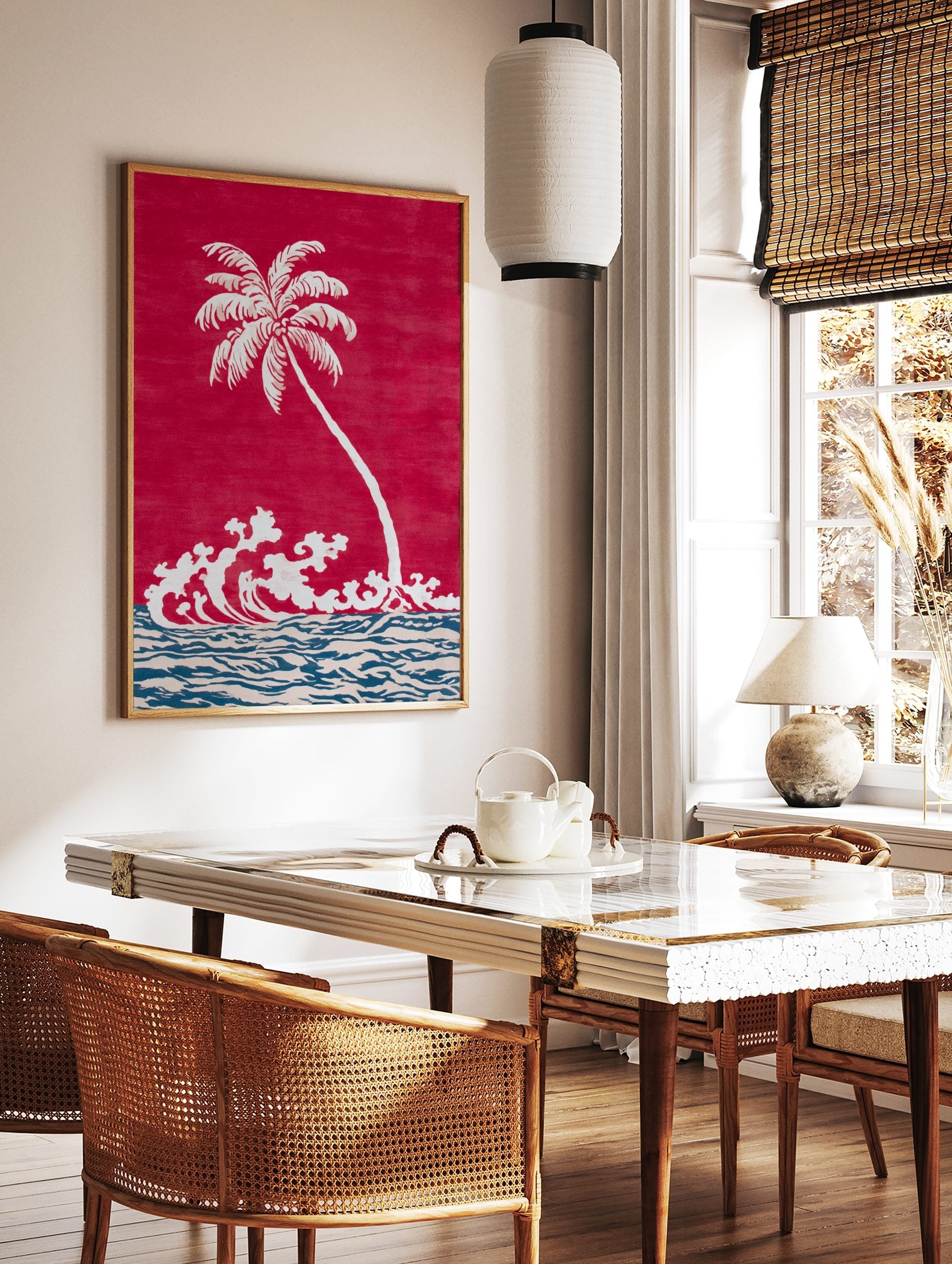 White palm tree and crashing waves illustration on a red background with blue and beige ocean, in a styled room mockup